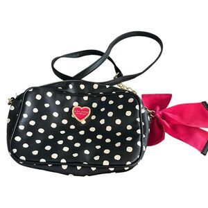 Betsey Johnson black polkadotted Crossbody bag with pink bows.